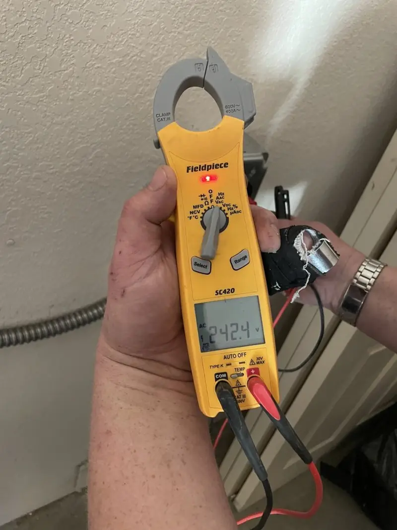 Voltage testing with clamp meter during Circuit Breaker Repair in Mason
